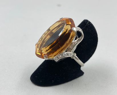 null Important platinum ring set with an exceptional oval topaz of about 50cts in...