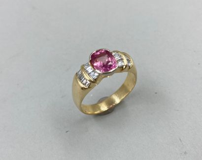null 18k yellow gold ring set with a pink sapphire of about 2cts in closed setting...