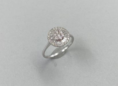 null Ring in 18k white gold, the round bezel paved with brilliant-cut and baguette-cut...