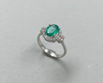 null Art Deco style ring in 18k white gold set with a 1ct oval emerald in a diamond...