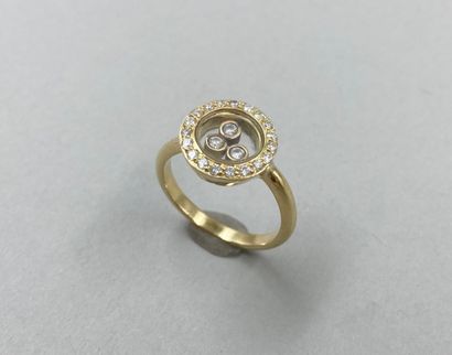 null 18k yellow gold ring with three mobile diamonds in a diamond setting in the...