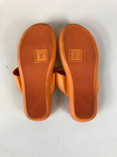 null LOUIS VUITTON

A pair of orange leather and rubber flip-flops with original...