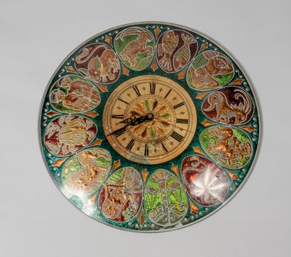 null Circular glass wall clock decorated with the twelve signs of the zodiac in cartouches....