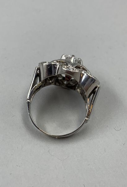 null 18k white gold and platinum flower ring centered on a 0.70ct old cut diamond...