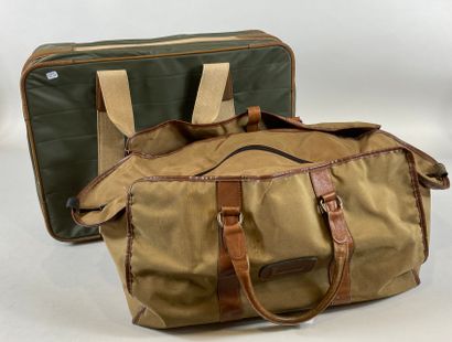 null Lot including:

- A LANCEL travel bag in green oilcloth, structure in thick...