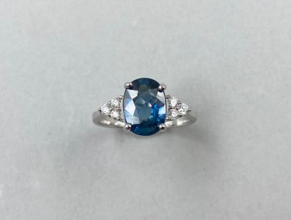 null 18k white gold ring set with a 2.92ct Vivid Blue sapphire and diamonds.

Gross...