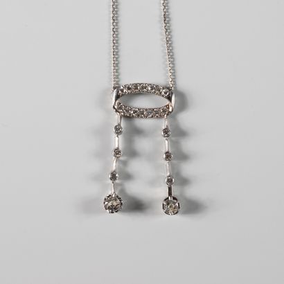 null Necklace in 18k white gold composed of a ring paved with old-cut diamonds holding...