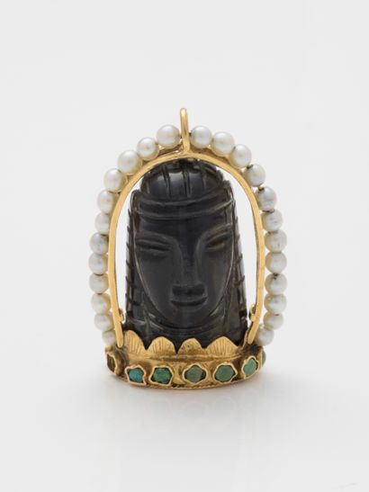 null Tiger eye pendant representing a Buddha head in a 18k yellow gold setting with...