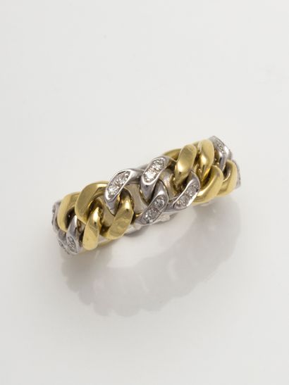 null 18k yellow and white gold ring, the white gold links set with diamonds. 

Gross...