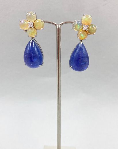 null 
Pair of 18k white gold earrings with a flower motif formed by four opal cabochons...
