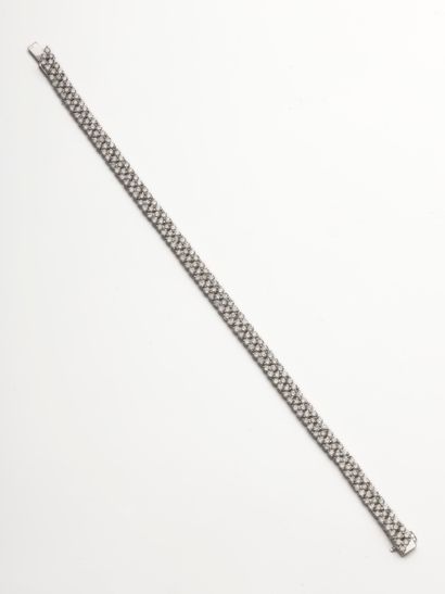 null Ribbon bracelet in 18k white gold formed by a line of triangular motifs each...