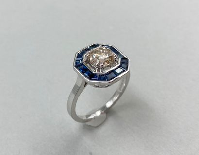 null Ring in 18k white gold, the octagonal bezel centered on a diamond of 1.10cts...