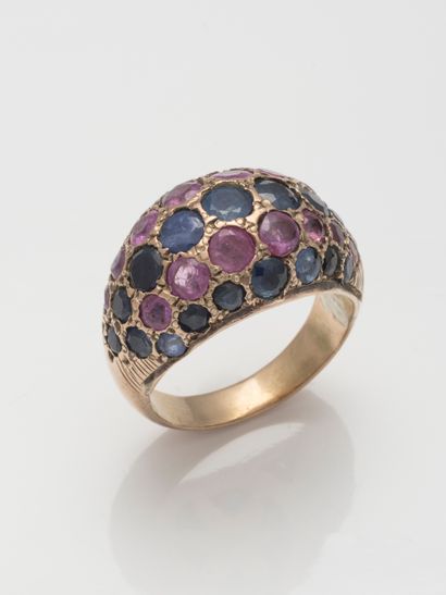 null 9k gold ring decorated with lines of alternating rubies and sapphires.

Work...
