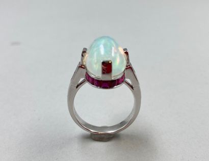 null 18k white gold ring set with a large opal cabochon of about 8 ct in a geometrical...