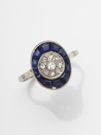 
18k white gold ring centered on a dome of...