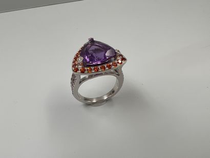 null MAUBOUSSIN 

18k white gold ring set with a trillion cut amethyst underlined...