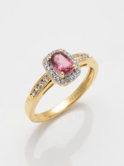 null A vermeil ring centered with a pink tourmaline in a zirconium frame. 

Gross...
