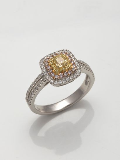 null Ring two 18k gold tiered, centered a diamond on yellow gold in a triple surround...