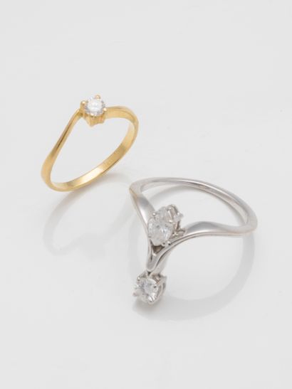 null Two small rings, one in 18k white gold, the other in 18k yellow gold, set with...