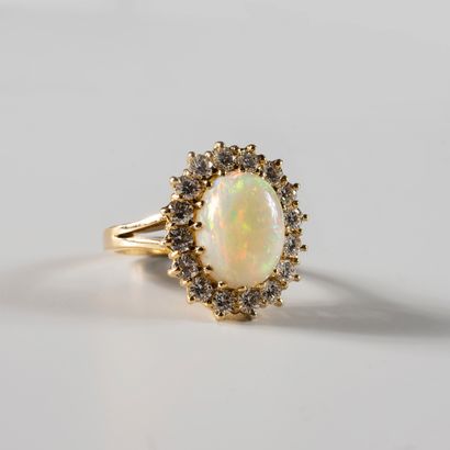 null Yellow gold ring 18k with an opal of 4 to 5 cts approximately surrounded by...