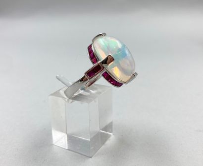 null 18k white gold ring set with a large opal cabochon of about 8 ct in a geometrical...