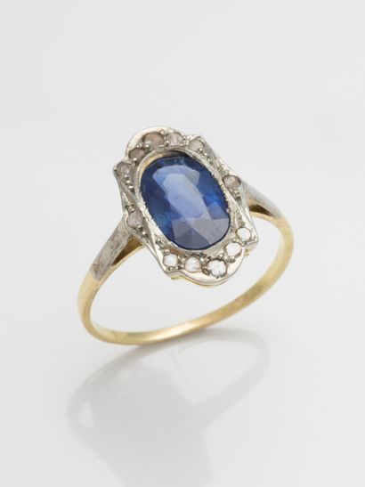 null An 18k gold ring set with a 1.47ct natural sapphire in a geometrical pattern...