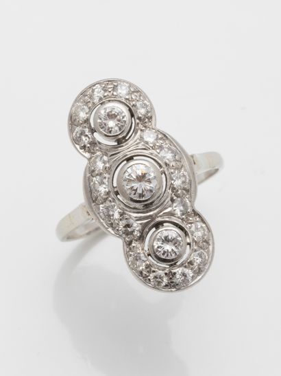 null 
Marquise ring in 14k white gold topped with a pavement of diamonds, three of...