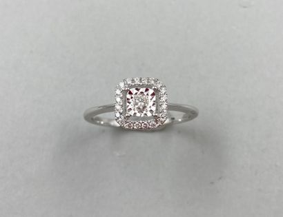 null Ring in 18k white gold, the square openwork bezel centered on a diamond in a...