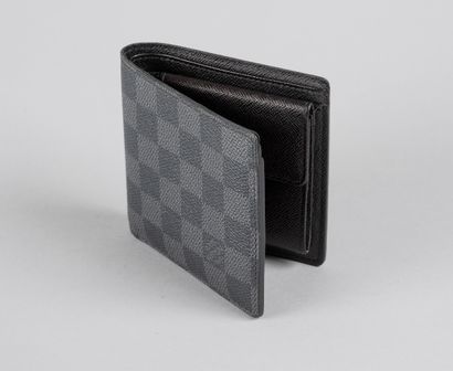 null LOUIS VUITTON

Circa 2008.

Black and grey leather wallet signed, sold with...
