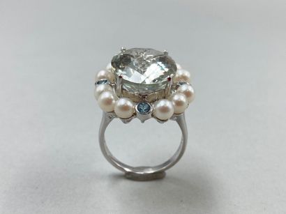 null Flower ring in 18k white gold centered on a large oval green amethyst in a circle...