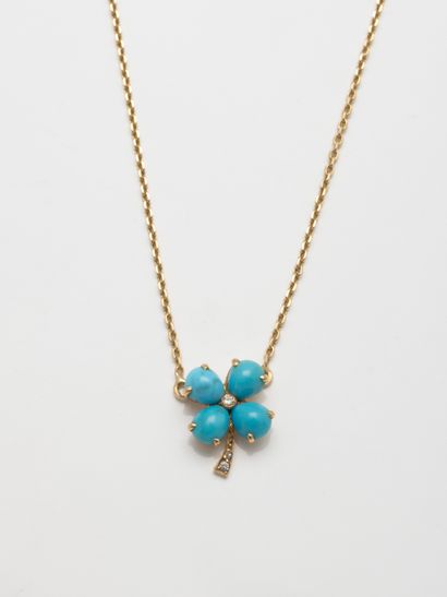 null 18k yellow gold necklace holding a clover set with cabochon turquoise and decorated...