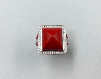 null Ring in 18k white gold, the square bezel centered on a carnelian cut in a sugar...