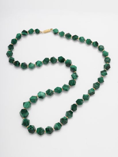 null Necklace of faceted malachite beads interspersed with gold beads.

Length :...