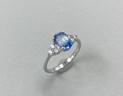 null 18k white gold ring set with a 2.05cts oval sapphire and 3 diamonds forming...