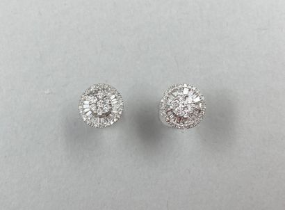 null Pair of round earrings in 18k white gold set with round diamonds interspersed...