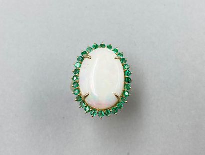 null Pompadour ring in 18k yellow gold set with a large opal cabochon of 9 ct surrounded...
