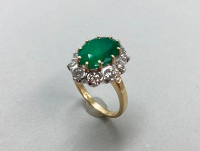 null Marquise ring in two 18k golds set with a Colombian emerald of about 4 cts in...