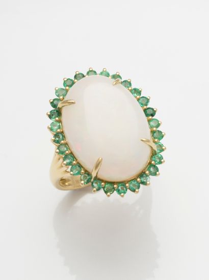 null Pompadour ring in 18k yellow gold set with a large opal cabochon of 9 ct surrounded...
