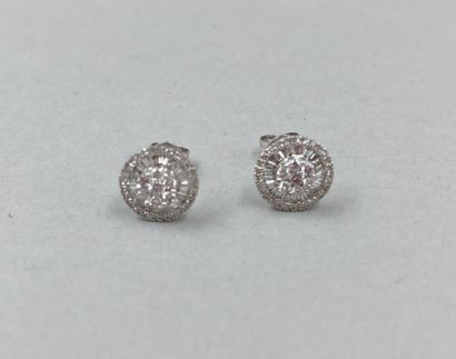 null Pair of round earrings in 18k white gold set with round diamonds interspersed...