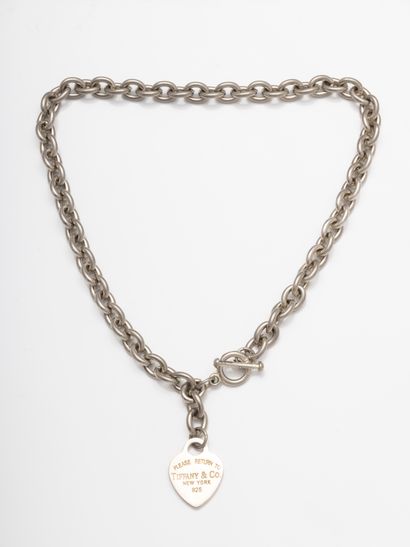 null TIFFANY CO 

Silver necklace with a heart engraved "Please return to Tiffany"....
