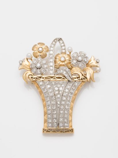 null 18k yellow and white gold brooch in the shape of a basket overflowing with flowers...