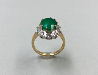 null Marquise ring in two 18k golds set with a Colombian emerald of about 4 cts in...