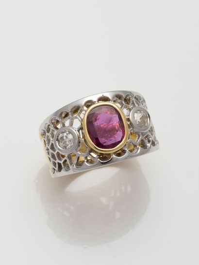 null 18k gold band ring centered on an oval ruby with two diamonds in a honeycomb...