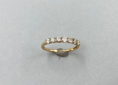 null Half wedding ring in 18k yellow gold set with a line of 7 diamonds.

Gross weight:...