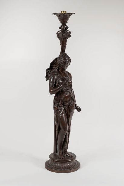 null Lamp stand representing Diana the huntress dressed in the antique style on a...