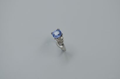 null 18k white gold ring set with a cushion-cut sapphire of about 2 cts. and small...