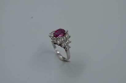null 
Ring in 18k white gold surmounted by a 1.55ct oval Burmese ruby in a setting...