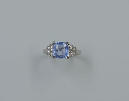 null 18k white gold ring set with a cushion-cut sapphire of about 2 cts. and small...