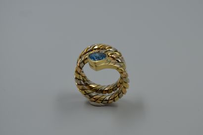 null 18k yellow and white gold snake ring set with a pear-shaped topaz.

Modern Italian...