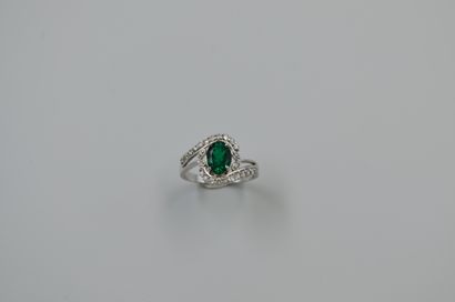 18k white gold ring set with a natural oval...